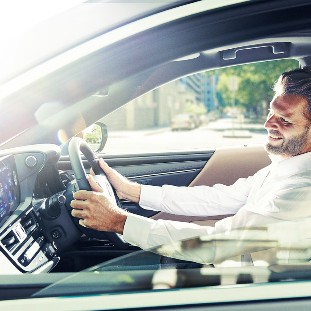 Man drives a 2021 ES, looking at the screen.