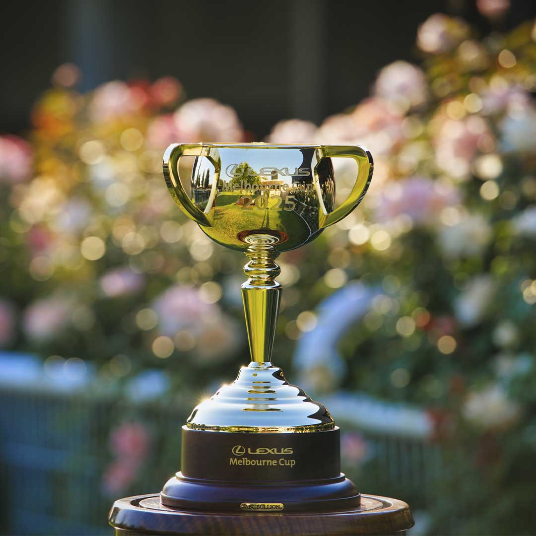 Close up of the Lexus Melbourne cup 2025 trophy with flowers in the background.